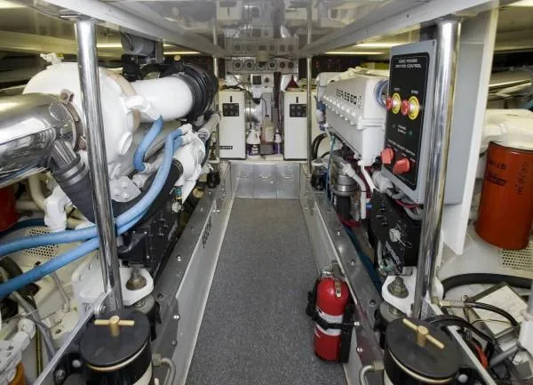 Slide: The Image of Engine room of a 1982 Pacifica Convertible boat, featuring complex machinery and control systems. - 6