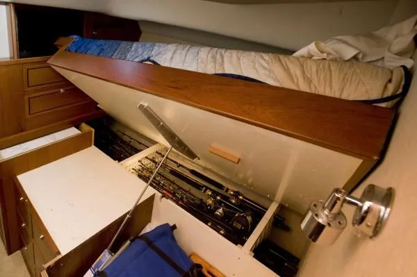 Slide: The Image of 1982 Pacifica Convertible interior with under-bed storage and fishing gear. - 7