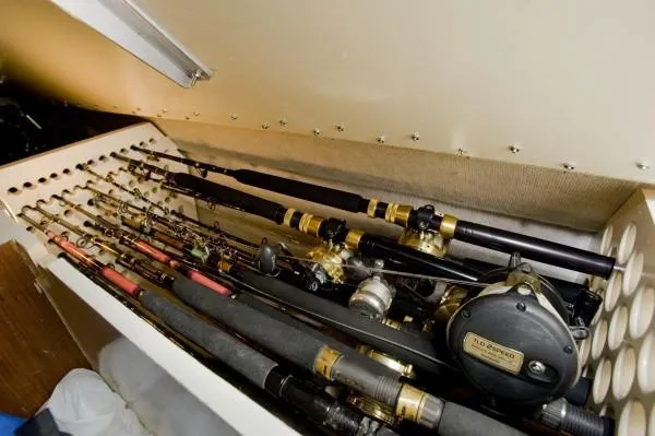 Slide: The Image of Fishing rods stored in a compartment of a 1982 Pacifica Convertible boat. - 8