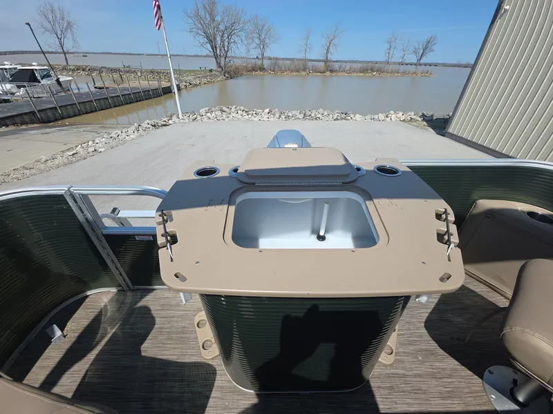 Slide: The Image of 2020 Bennington S 20 SS pontoon boat interior with helm and lake view. - 11