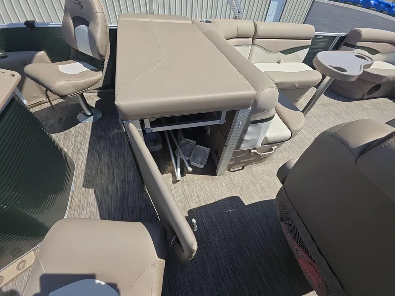 Slide: The Image of 2020 Bennington S 20 SS pontoon boat interior with beige seating and table. - 14