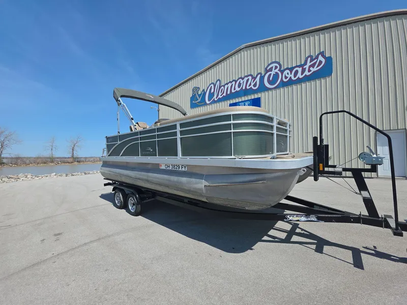 Slide: The Image of 2020 Bennington S 20 SS pontoon boat on trailer at Clemons Boats dealership. - 2