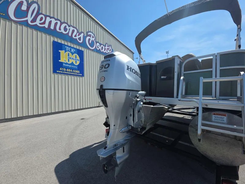 Slide: The Image of 2020 Bennington S 20 SS pontoon boat with Honda outboard motor at Clemons Boats dealership. - 5