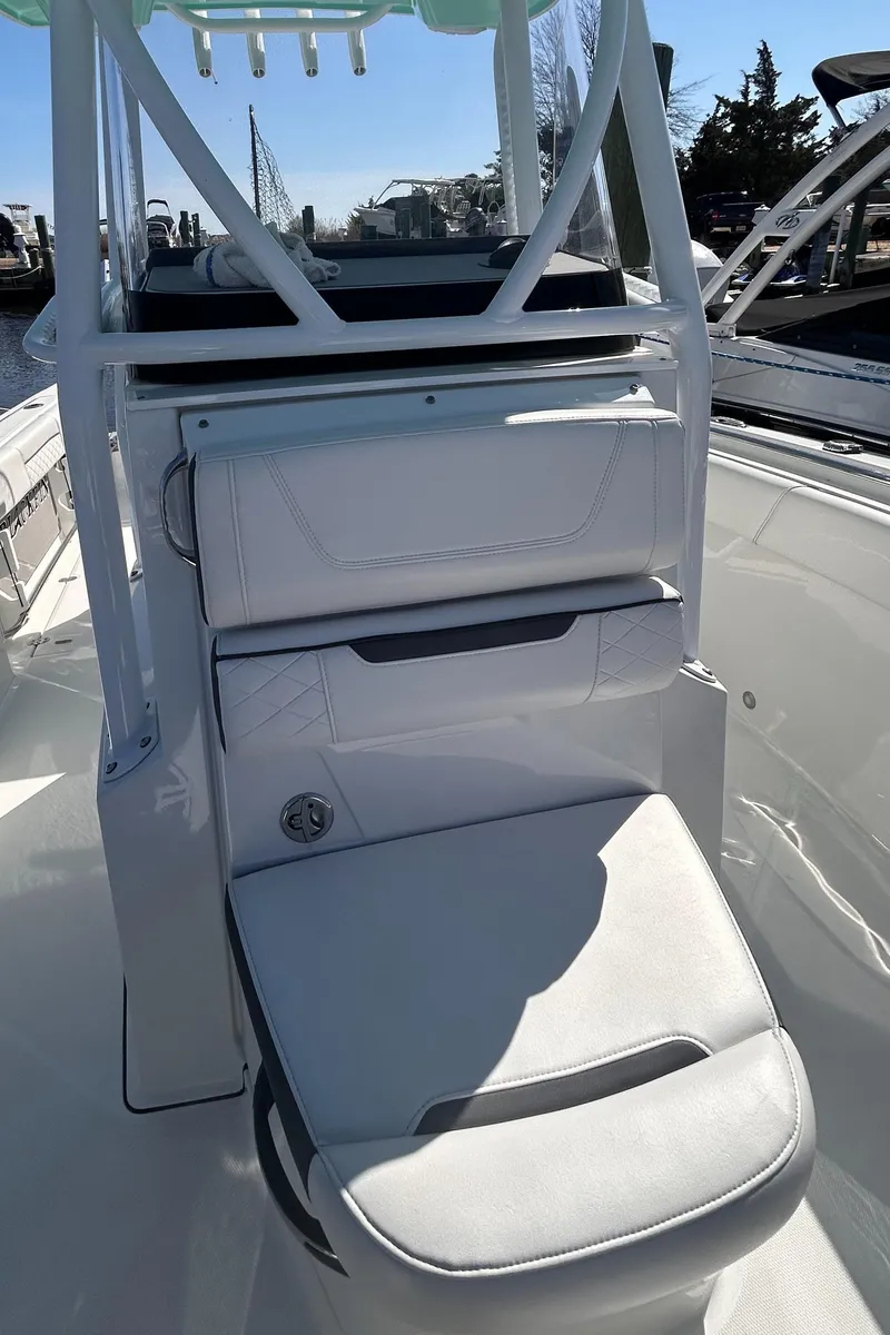 Slide: The Image of 2021 Blackfin 252 CC boat interior with white seating and sleek design. - 6