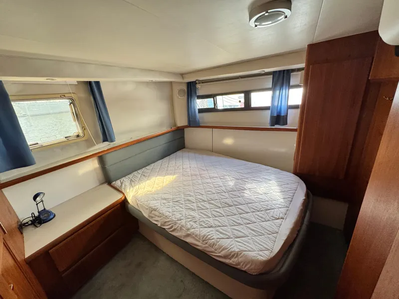 Slide: The Image of Interior view of 1994 Carver 350 Aft Cabin yacht in harbor. - 33