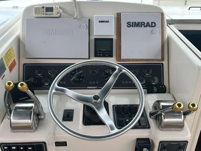Slide: The Image of Control panel of a 1998 Pursuit 3400 Express boat with Simrad equipment. - 7