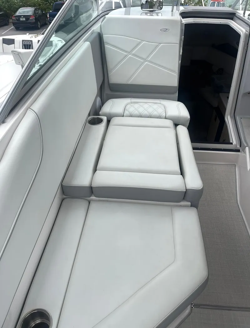 Slide: The Image of 2024 Regal 26 XO boat interior with luxurious seating and modern design. - 10