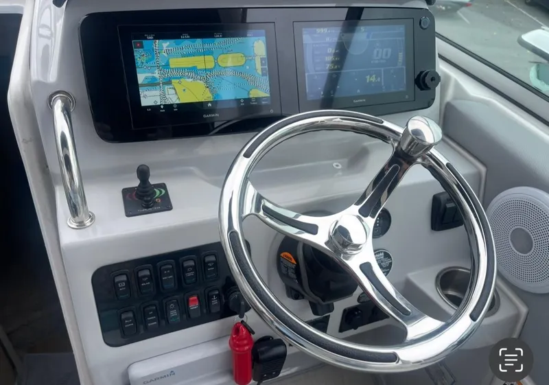 Slide: The Image of 2024 Regal 26 XO boat dashboard with modern navigation and control systems. - 15