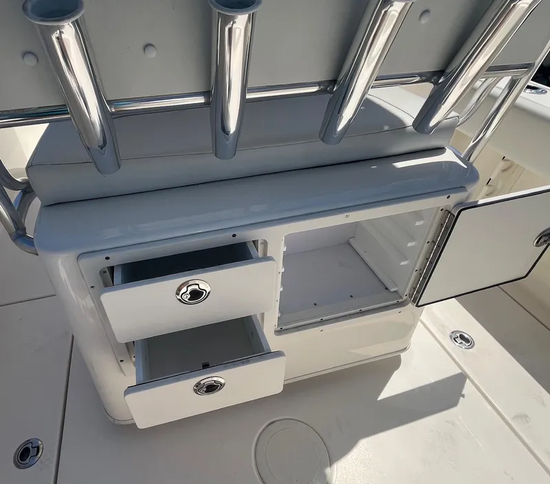 Slide: The Image of Cobia 237 Center Console 2022 with storage and rod holders. - 10