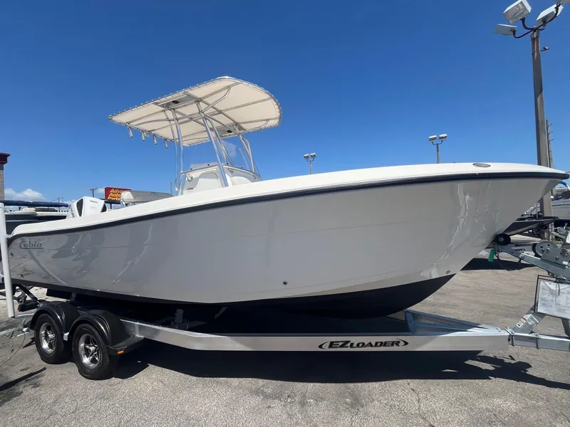 Slide: The Image of 2022 Cobia 237 Center Console on trailer, side view. - 2