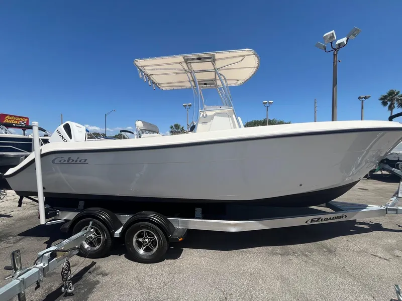 Slide: The Image of 2022 Cobia 237 Center Console boat on trailer. - 3