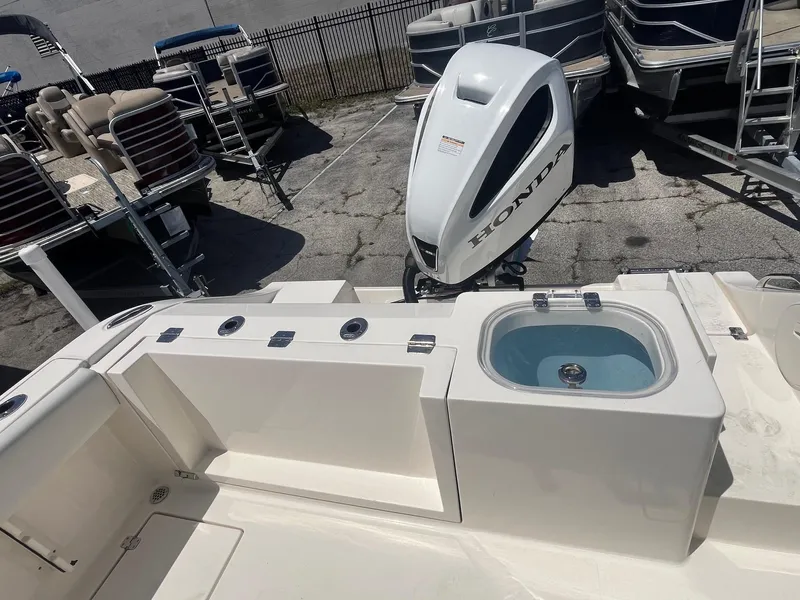 Slide: The Image of 2022 Cobia 237 Center Console with Honda outboard motor. - 4