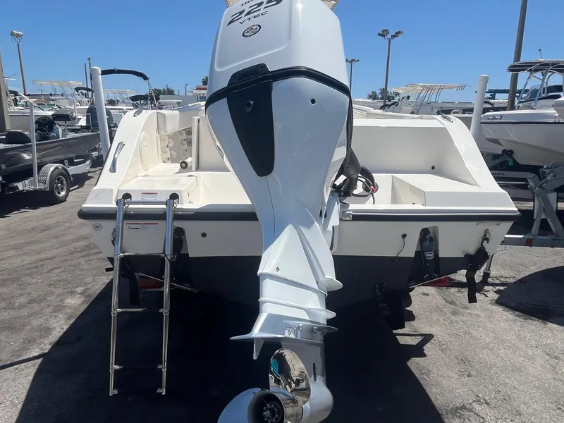Slide: The Image of Rear view of 2022 Cobia 237 Center Console boat with outboard motor. - 9
