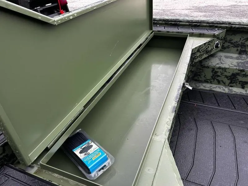 Slide: The Image of Open storage compartment in a 2025 Gator Tail 1754 Extreme boat, with packaged item inside. - 11