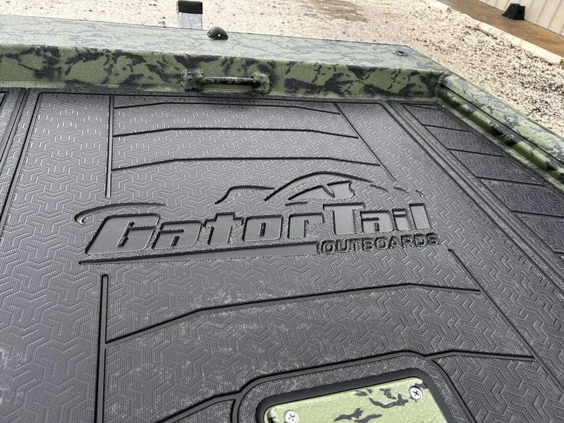 Slide: The Image of 2025 Gator Tail 1754 Extreme boat deck with logo, textured surface, and camouflage design. - 13