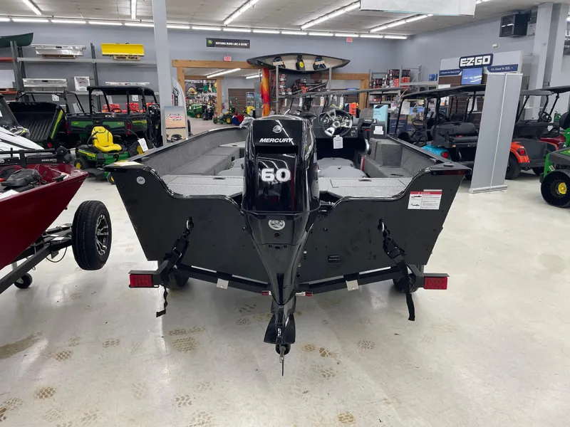 Slide: The Image of 2025 Lowe FM1675S boat with Mercury 60 engine displayed in showroom. - 4