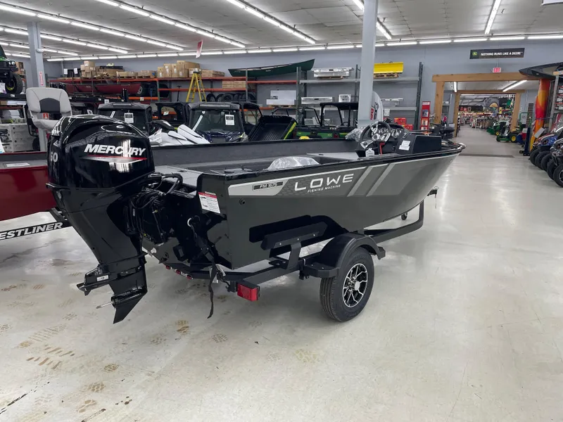 Slide: The Image of 2025 Lowe FM1675S boat with Mercury engine displayed indoors. - 6