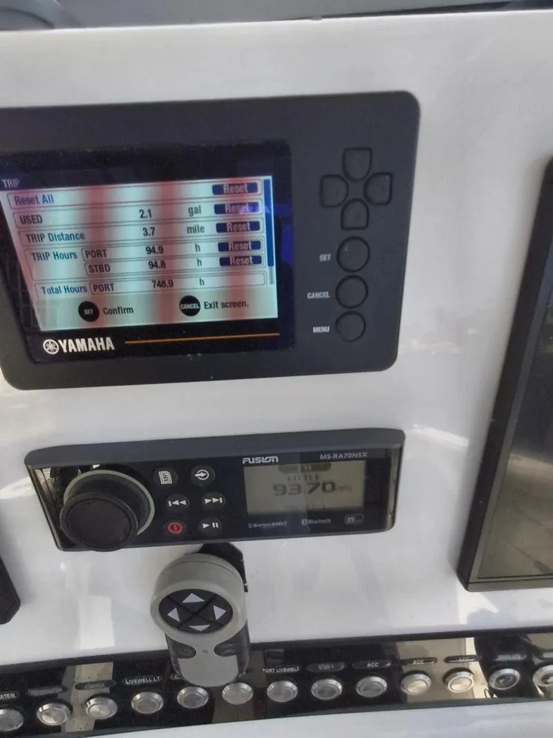 Slide: The Image of Dashboard of a 2021 Key West 263 FS boat with Yamaha and Fusion displays. - 6
