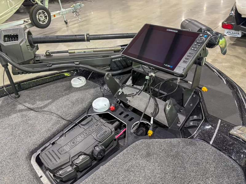 Slide: The Image of 2025 Skeeter FXR20 boat dashboard with advanced navigation and control systems. - 11