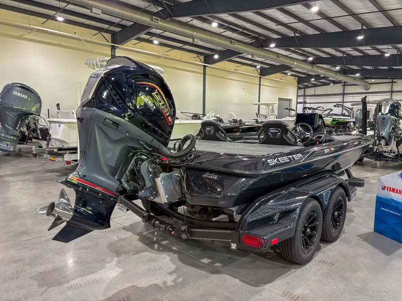 Slide: The Image of 2025 Skeeter FXR20 boat with Yamaha outboard motor in showroom setting. - 3