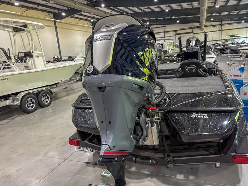 Slide: The Image of 2025 Skeeter FXR20 boat with powerful outboard motor in showroom. - 4