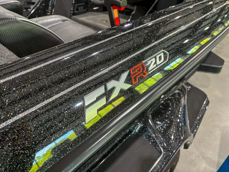 Slide: The Image of 2025 Skeeter FXR20 boat with sleek black finish and vibrant logo detailing. - 6