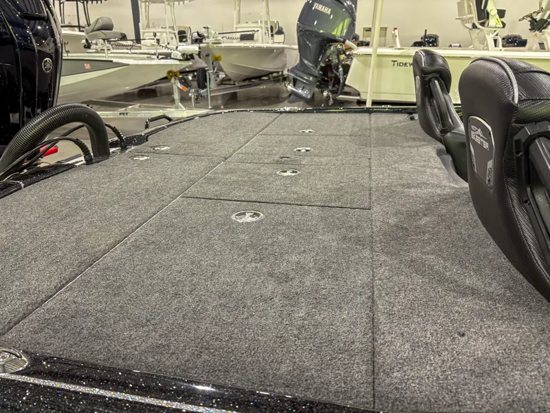Slide: The Image of 2025 Skeeter FXR20 boat deck with carpeted surface and seating. - 9