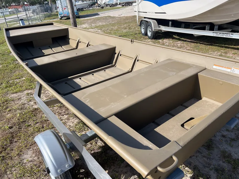 Slide: The Image of 2025 G3 1544LW hull on trailer, beige color, parked outdoors. - 6