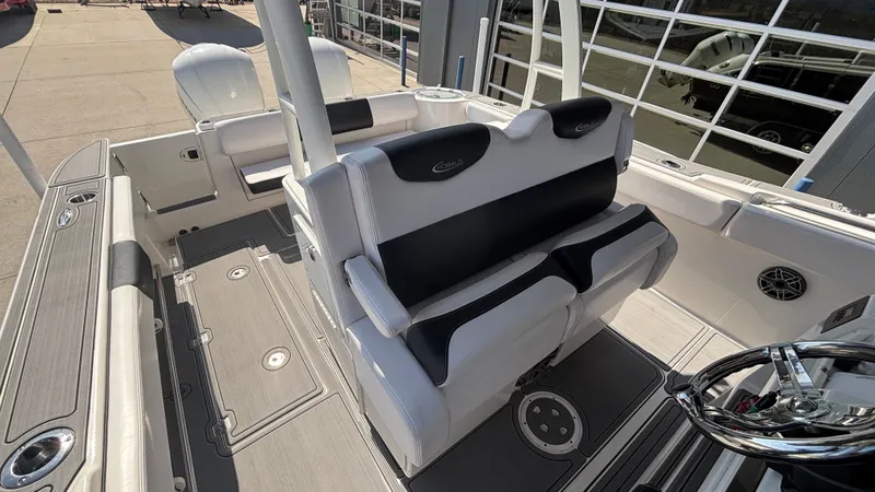 Slide: The Image of 2021 Robalo R302 CC boat interior with sleek seating and modern design. - 19