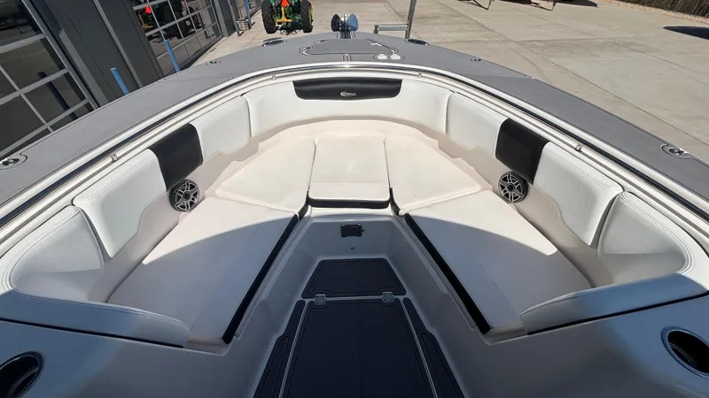 Slide: The Image of 2021 Robalo R302 CC boat interior with spacious seating and modern design. - 21
