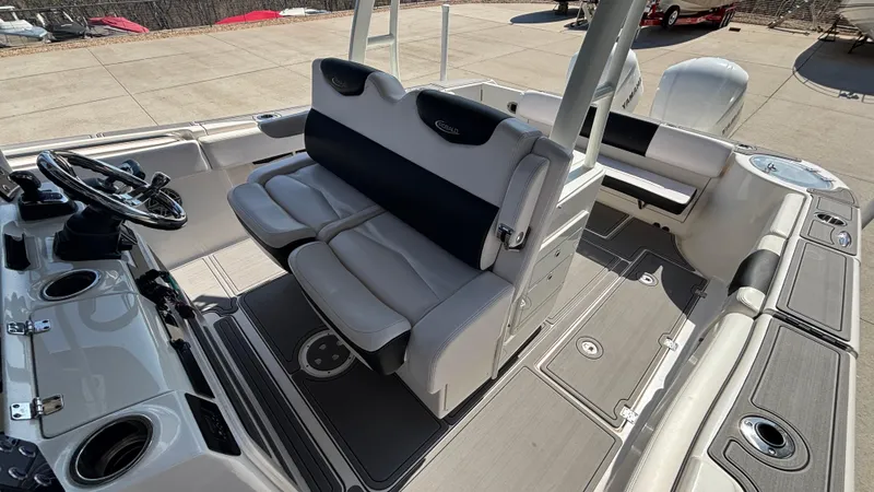 Slide: The Image of 2021 Robalo R302 CC boat interior with seating and steering wheel. - 27