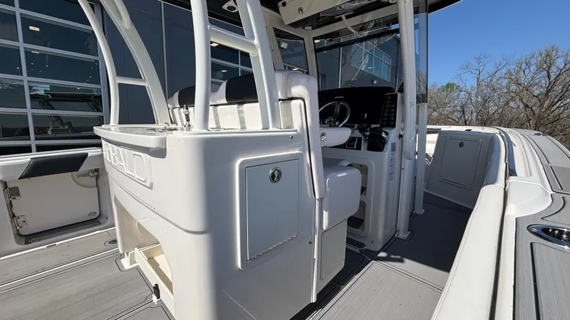 Slide: The Image of 2021 Robalo R302 CC boat interior with modern helm and seating. - 36