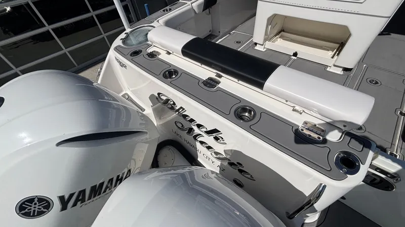 Slide: The Image of 2021 Robalo R302 CC boat with Yamaha engines, featuring a sleek deck design. - 38