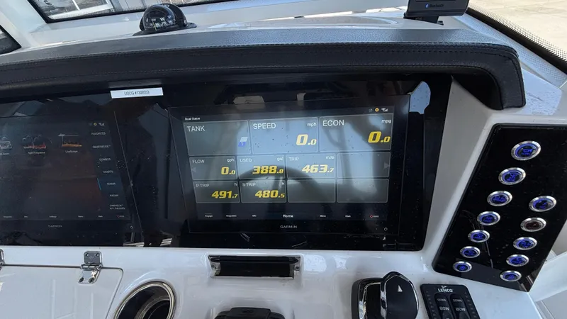 Slide: The Image of Dashboard of 2021 Robalo R302 CC boat with digital display and controls. - 45