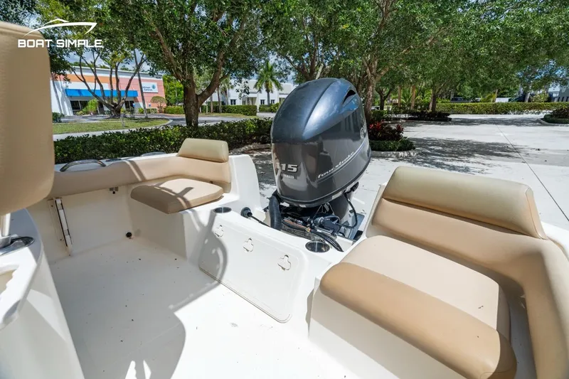 Slide: The Image of 2022 Scout 195 Sportfish boat interior with seating and outboard motor. - 17