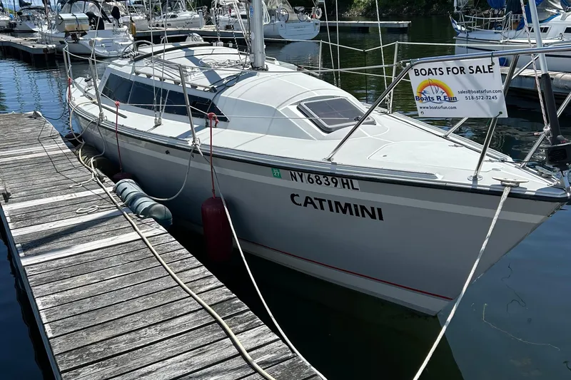 Slide: The Image of 1989 O'Day 272 sailboat "Catimini" docked, for sale sign visible. - 0