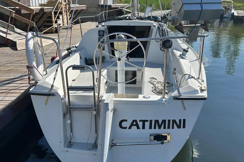 Slide: The Image of 1989 O'Day 272 sailboat "CATIMINI" docked at marina, rear view. - 1