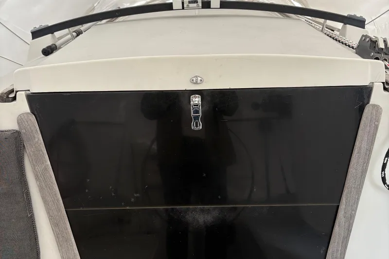 Slide: The Image of 1989 O'Day 272 sailboat hatch with black panel and latch. - 4