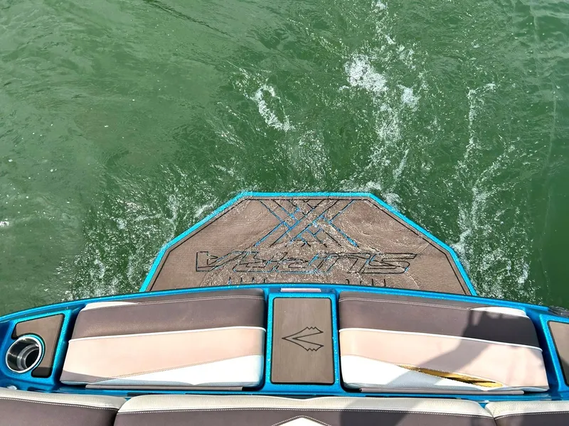 Slide: The Image of 2017 Supra SE 550 boat platform on water, showcasing wake and seating area. - 20