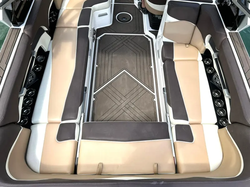 Slide: The Image of 2017 Supra SE 550 boat interior with beige and brown seating, stylish design. - 24