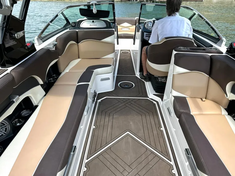 Slide: The Image of 2017 Supra SE 550 boat interior with luxurious seating and modern design on the water. - 25