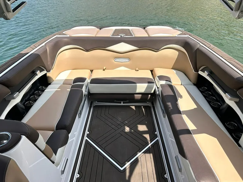 Slide: The Image of 2017 Supra SE 550 boat interior with luxurious seating and elegant design on water. - 27
