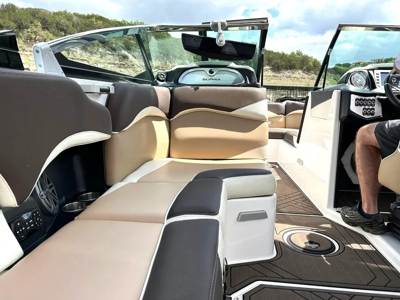 Slide: The Image of 2017 Supra SE 550 boat interior with luxurious seating and modern dashboard. - 33