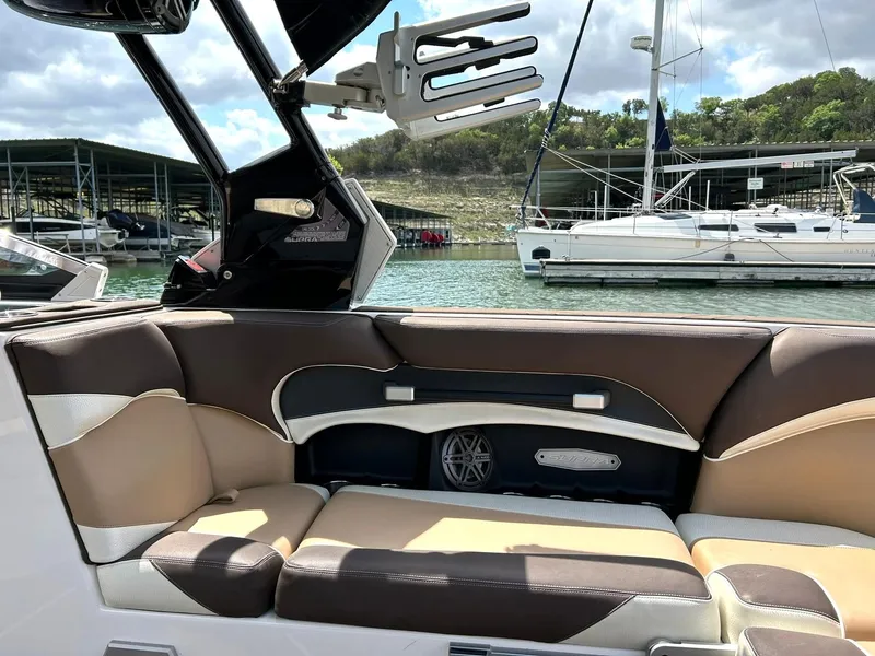 Slide: The Image of Interior of a 2017 Supra SE 550 boat with brown and beige seating. - 37