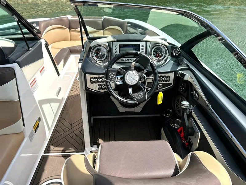 Slide: The Image of 2017 Supra SE 550 boat interior with modern dashboard and steering wheel. - 39