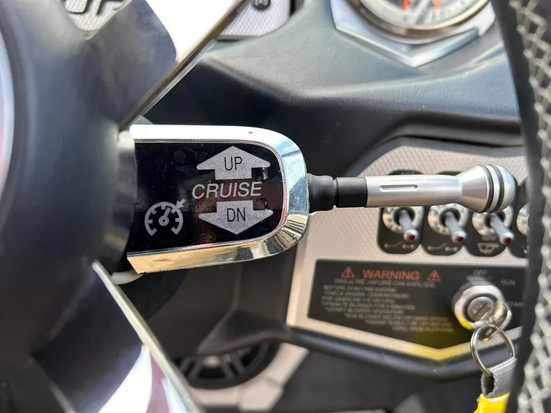 Slide: The Image of Cruise control lever in 2017 Supra SE 550 boat dashboard. - 42