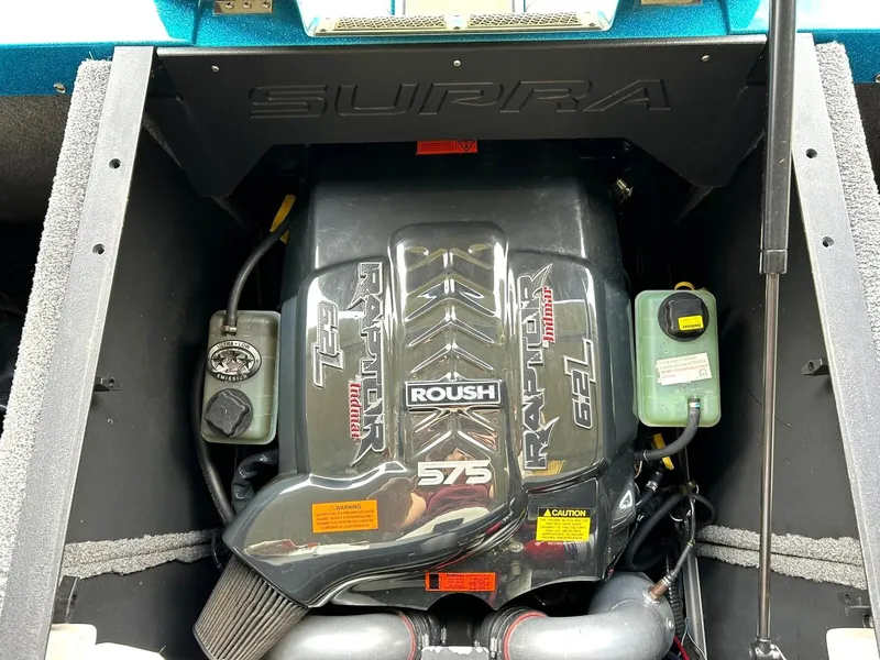 Slide: The Image of 2017 Supra SE 550 engine compartment featuring a Roush Raptor 575 motor. - 43