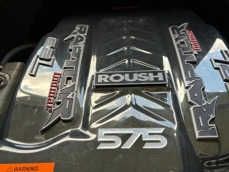 Slide: The Image of 2017 Supra SE 550 engine cover with Roush and Indmar Raptor branding. - 45