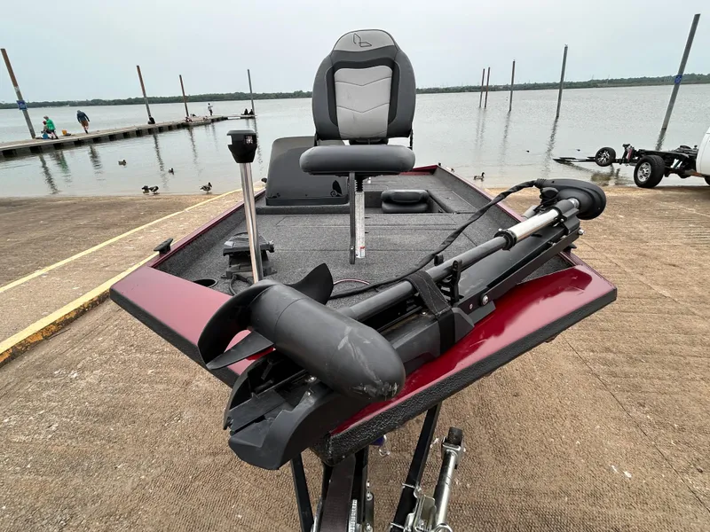 Slide: The Image of 2022 Lowe Skorpion 17 boat at dock, featuring a sleek design and modern equipment. - 13