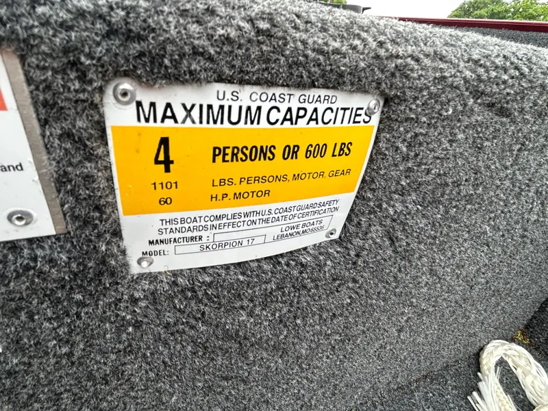 Slide: The Image of U.S. Coast Guard capacity label on 2022 Lowe Skorpion 17 boat, 4 persons or 600 lbs. - 17